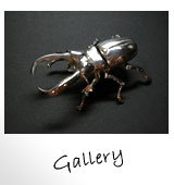 �M�������[